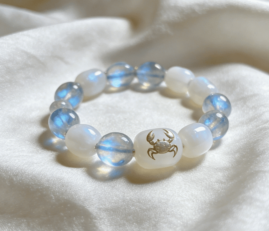 Cancer nurturing mala bracelet with moonstone and white jade beads on white silk surface