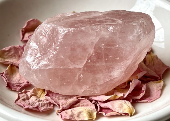 Rose quartz with rose petals